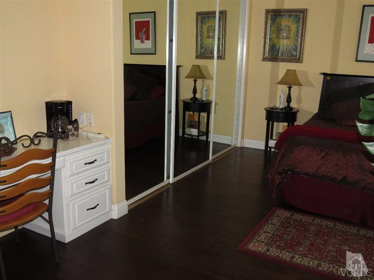 4047 Nice Court Oxnard, CA 93035 - Photo 29 of 31 a view of a bedroom with furniture and wooden floor