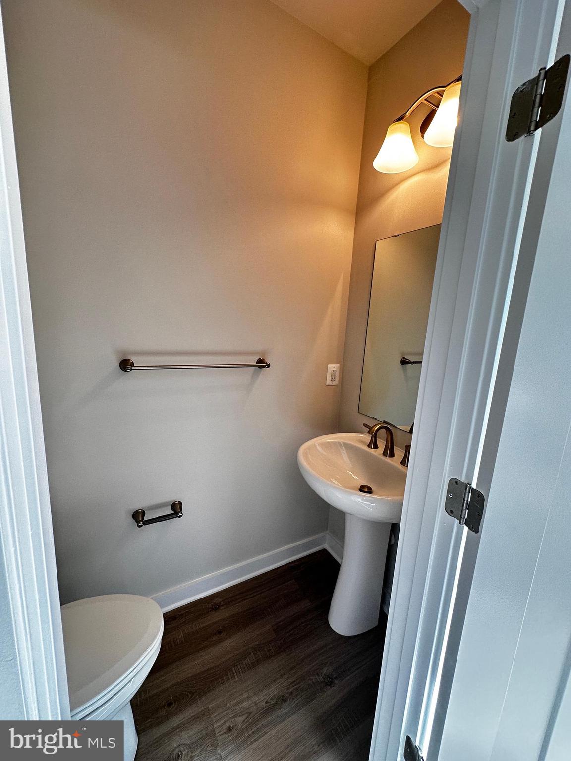 30 Trotting Road Inwood, WV 25428 - Photo 28 of 61 a bathroom with a toilet sink and mirror