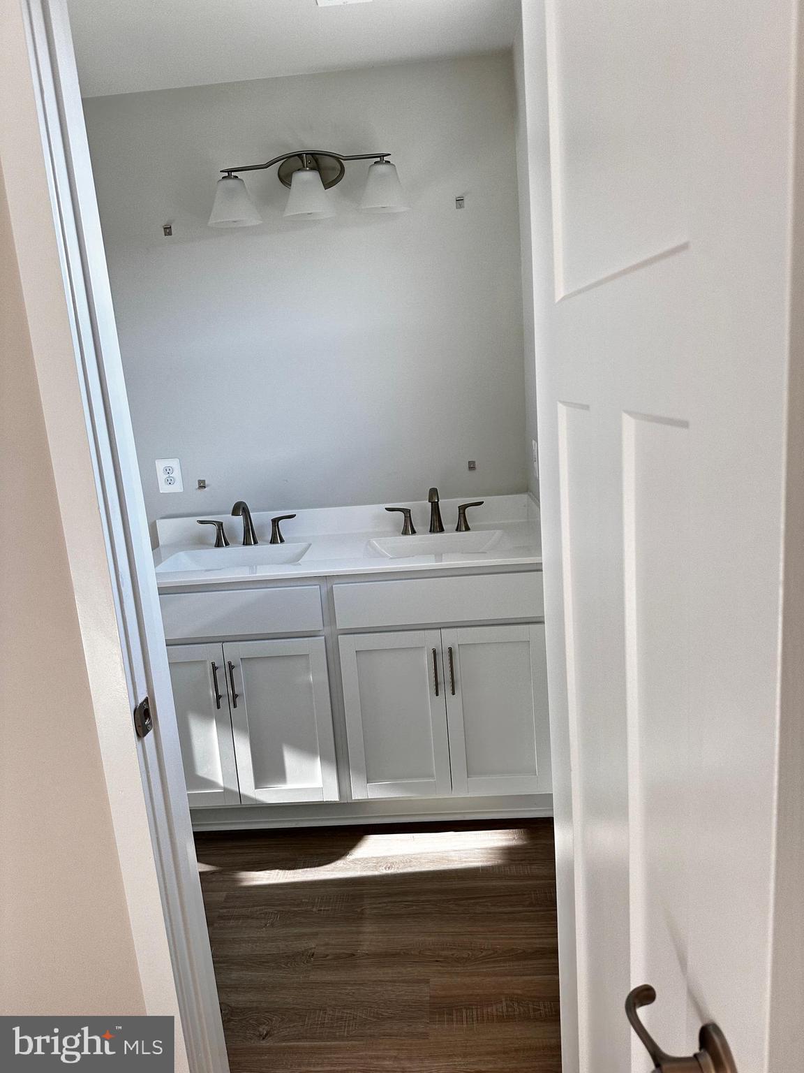 30 Trotting Road Inwood, WV 25428 - Photo 44 of 61 a bathroom with a sink a toilet and a mirror