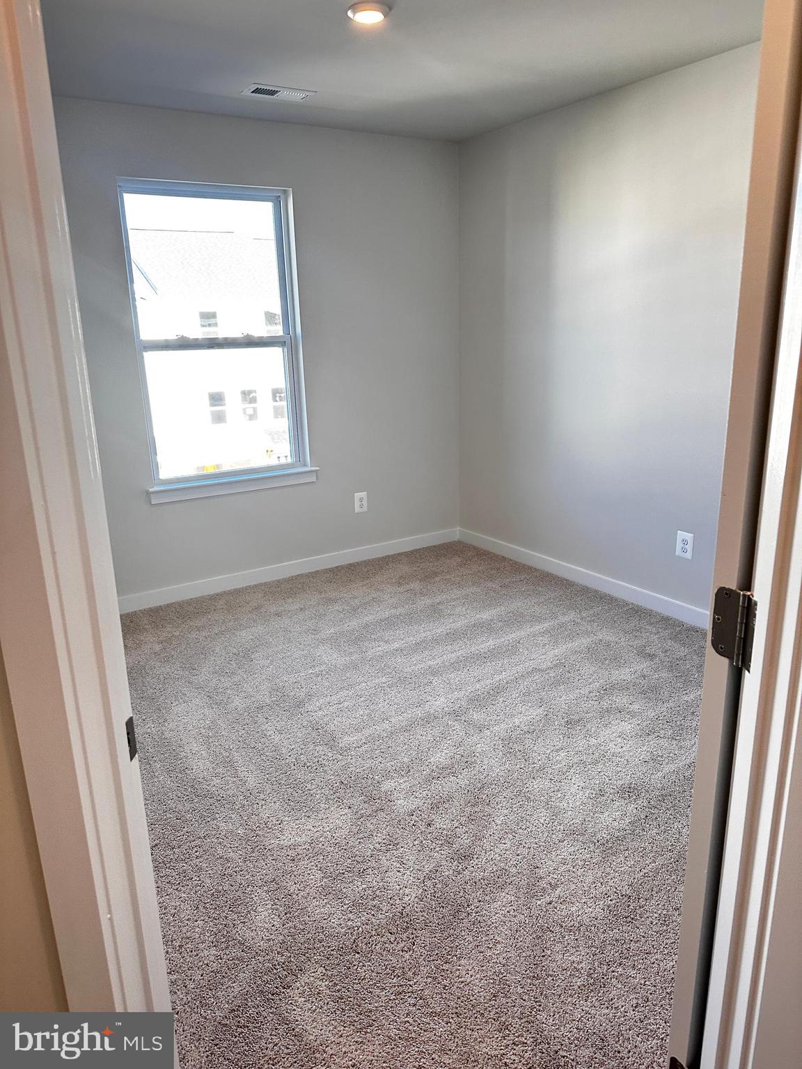 30 Trotting Road Inwood, WV 25428 - Photo 54 of 61 an empty room with a window