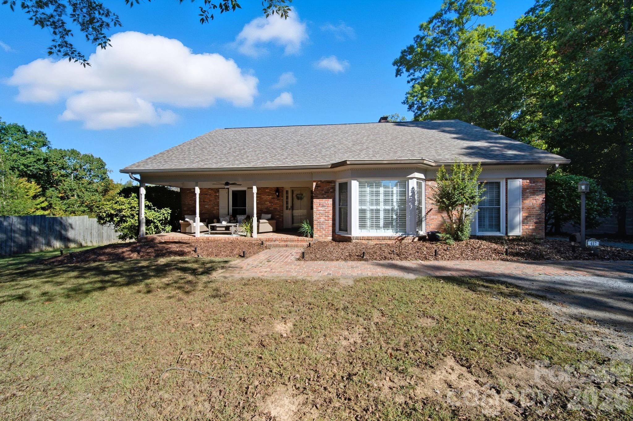 417 Park Ridge Road Albemarle, NC 28001 - Photo 1 of 47 a view of a house with backyard porch and sitting area