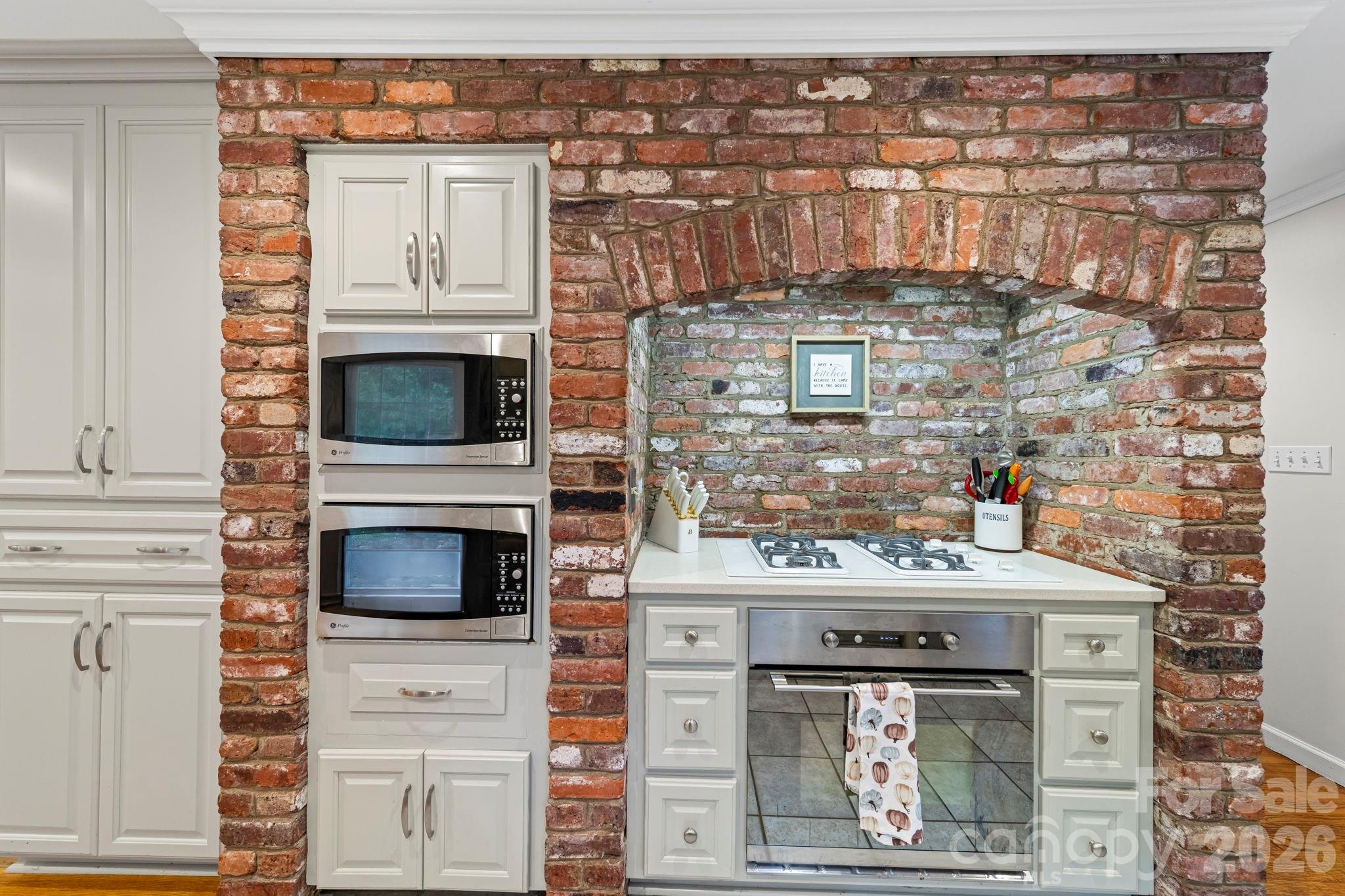 417 Park Ridge Road Albemarle, NC 28001 - Photo 11 of 47 a kitchen with a stove and a microwave