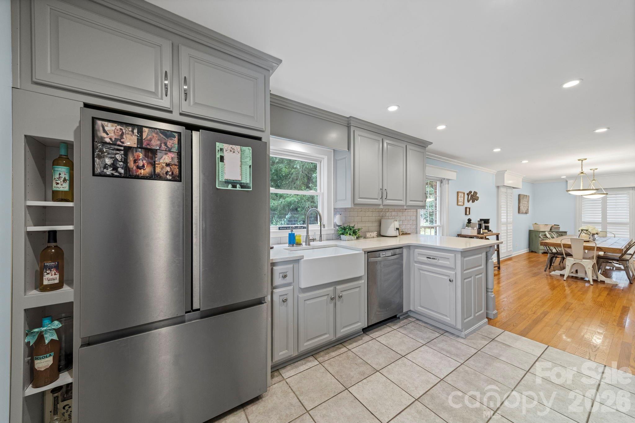 417 Park Ridge Road Albemarle, NC 28001 - Photo 13 of 47 a kitchen with stainless steel appliances granite countertop a refrigerator sink and cabinets
