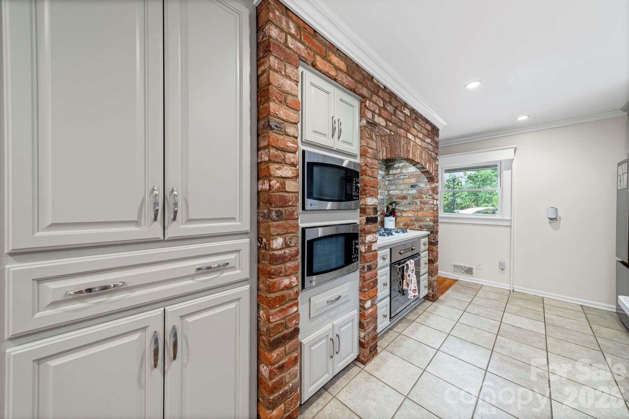 417 Park Ridge Road Albemarle, NC 28001 - Photo 15 of 47 a kitchen with stainless steel appliances a sink and a stove top oven