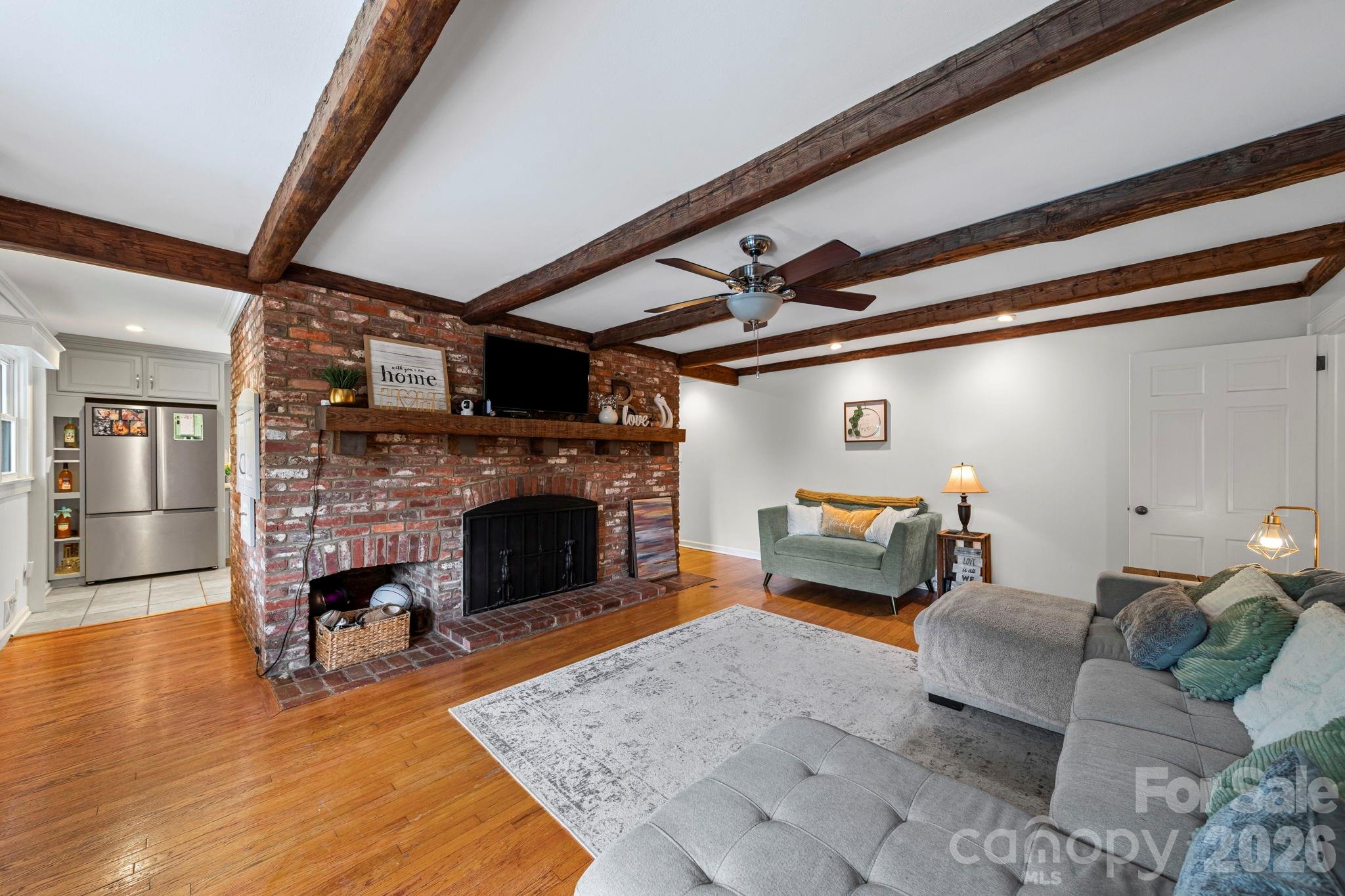 417 Park Ridge Road Albemarle, NC 28001 - Photo 19 of 47 a living room with furniture and a fireplace