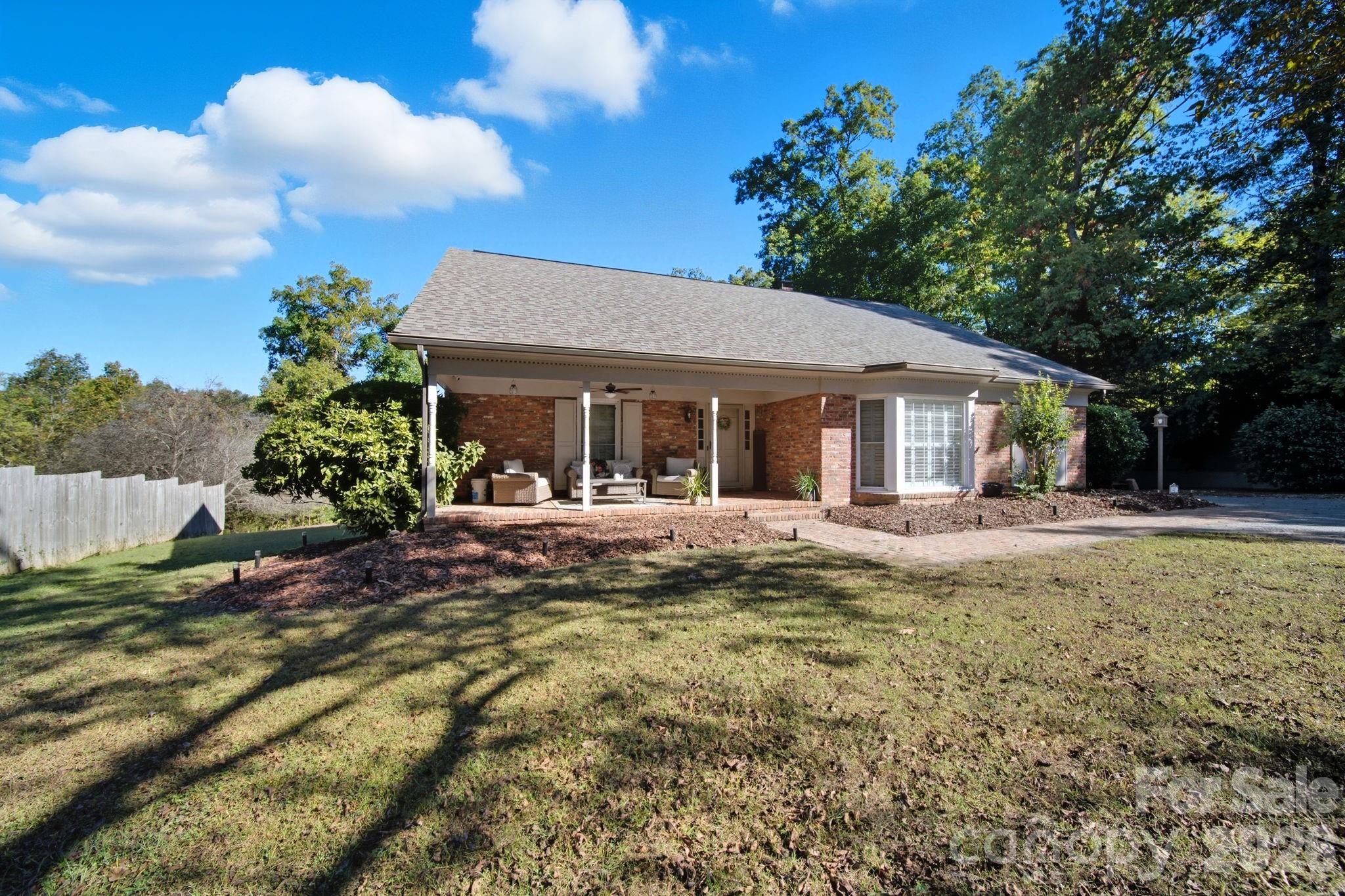 417 Park Ridge Road Albemarle, NC 28001 - Photo 2 of 47 a view of a house with backyard and sitting area