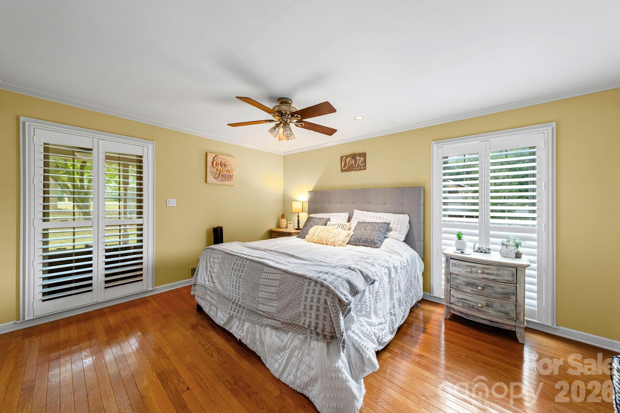 417 Park Ridge Road Albemarle, NC 28001 - Photo 21 of 47 a bedroom with a bed and a ceiling fan
