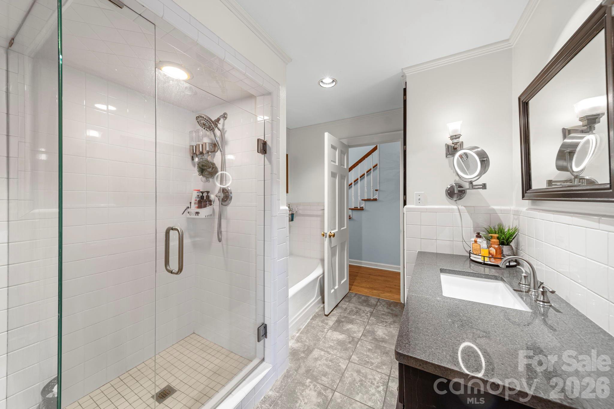417 Park Ridge Road Albemarle, NC 28001 - Photo 24 of 47 a bathroom with a granite countertop shower a sink and a mirror