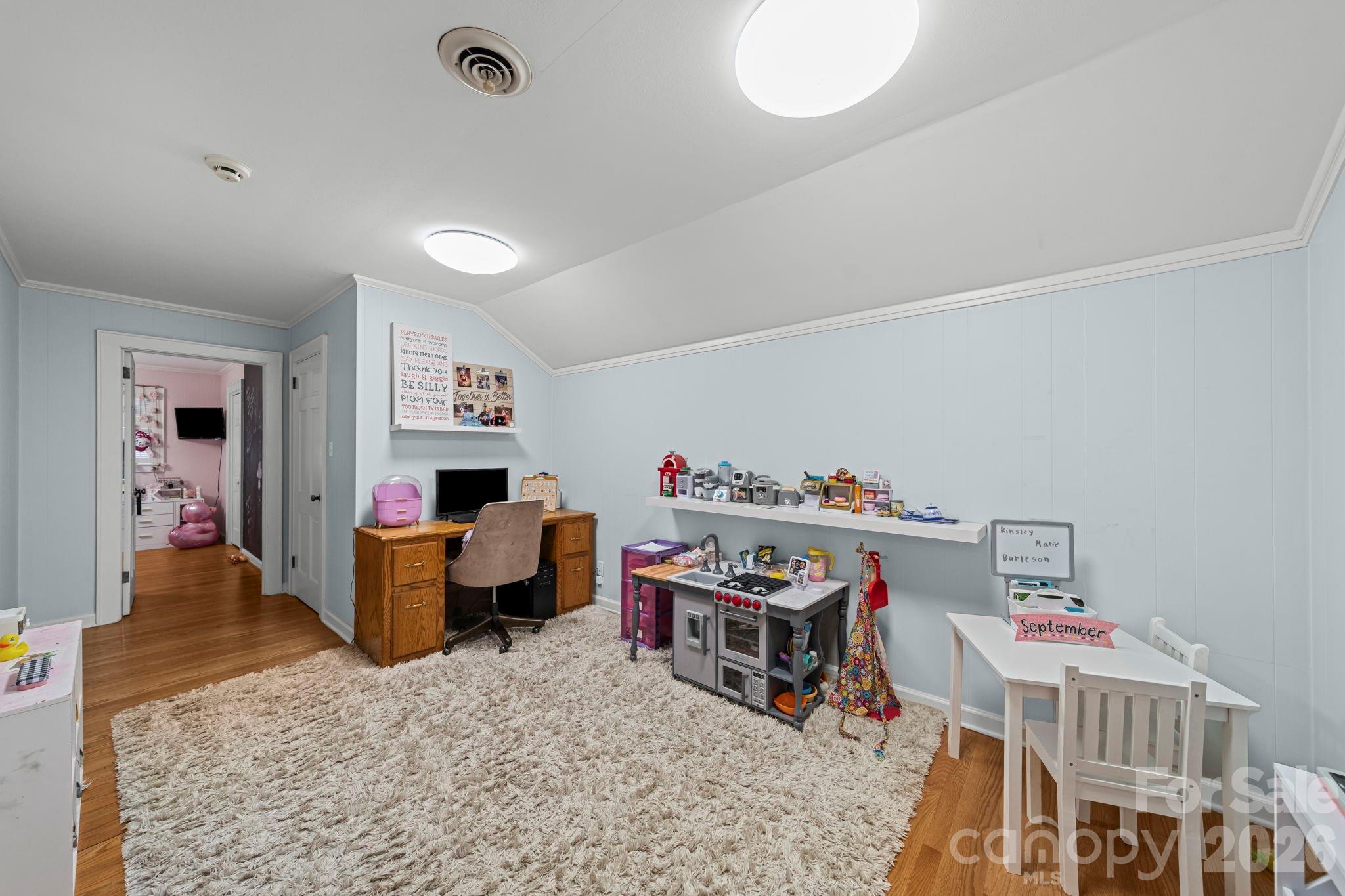 417 Park Ridge Road Albemarle, NC 28001 - Photo 28 of 47 a living room with furniture and a baby crib