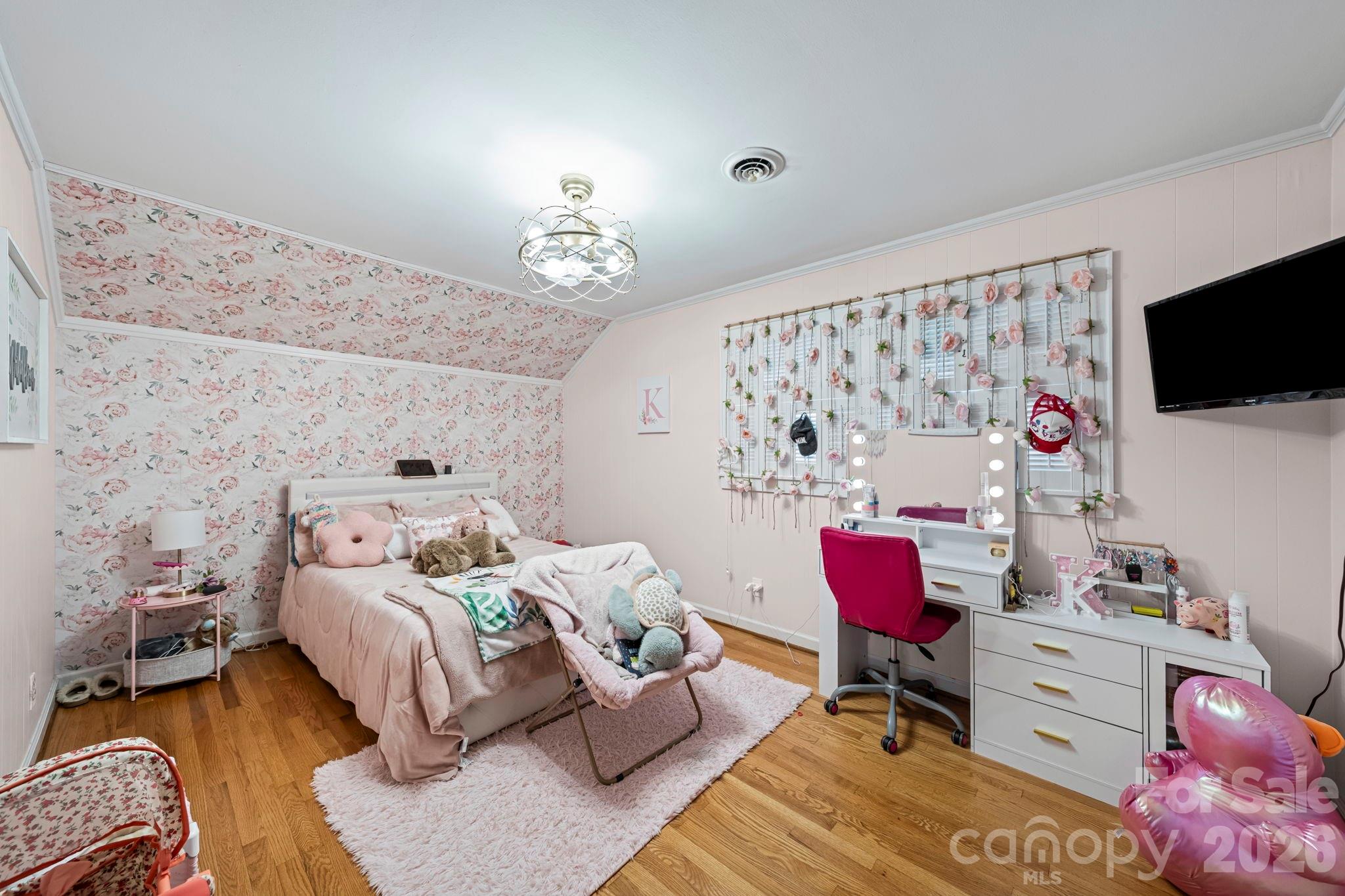 417 Park Ridge Road Albemarle, NC 28001 - Photo 30 of 47 a bedroom with a bed and a flat screen tv