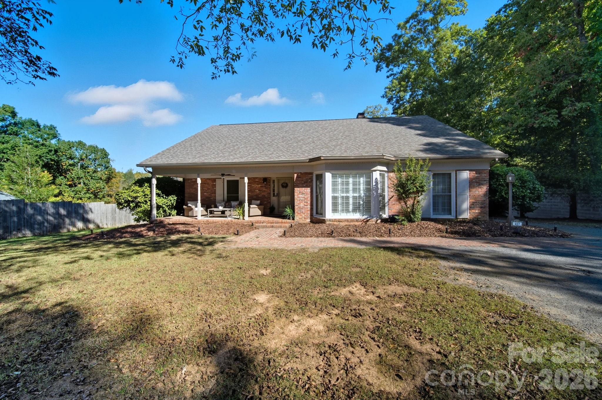 417 Park Ridge Road Albemarle, NC 28001 - Photo 3 of 47 a view of a house with swimming pool and sitting area
