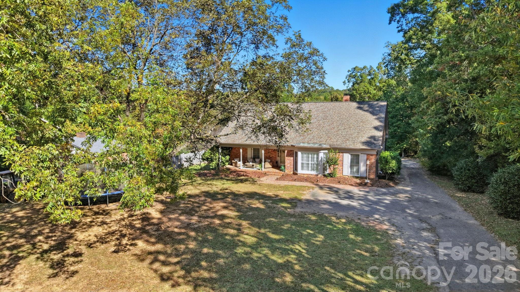 417 Park Ridge Road Albemarle, NC 28001 - Photo 4 of 47 a front view of a house with a garden