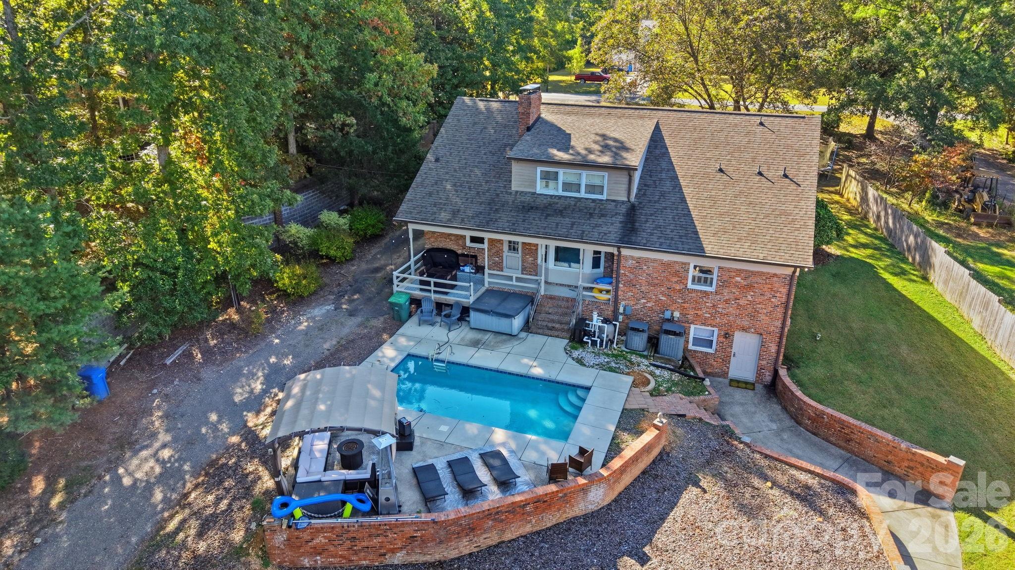 417 Park Ridge Road Albemarle, NC 28001 - Photo 41 of 47 an aerial view of a house with swimming pool garden and patio