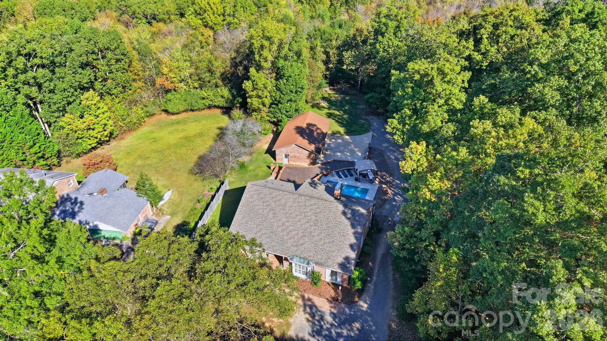 417 Park Ridge Road Albemarle, NC 28001 - Photo 43 of 47 an aerial view of a house with a yard and trees