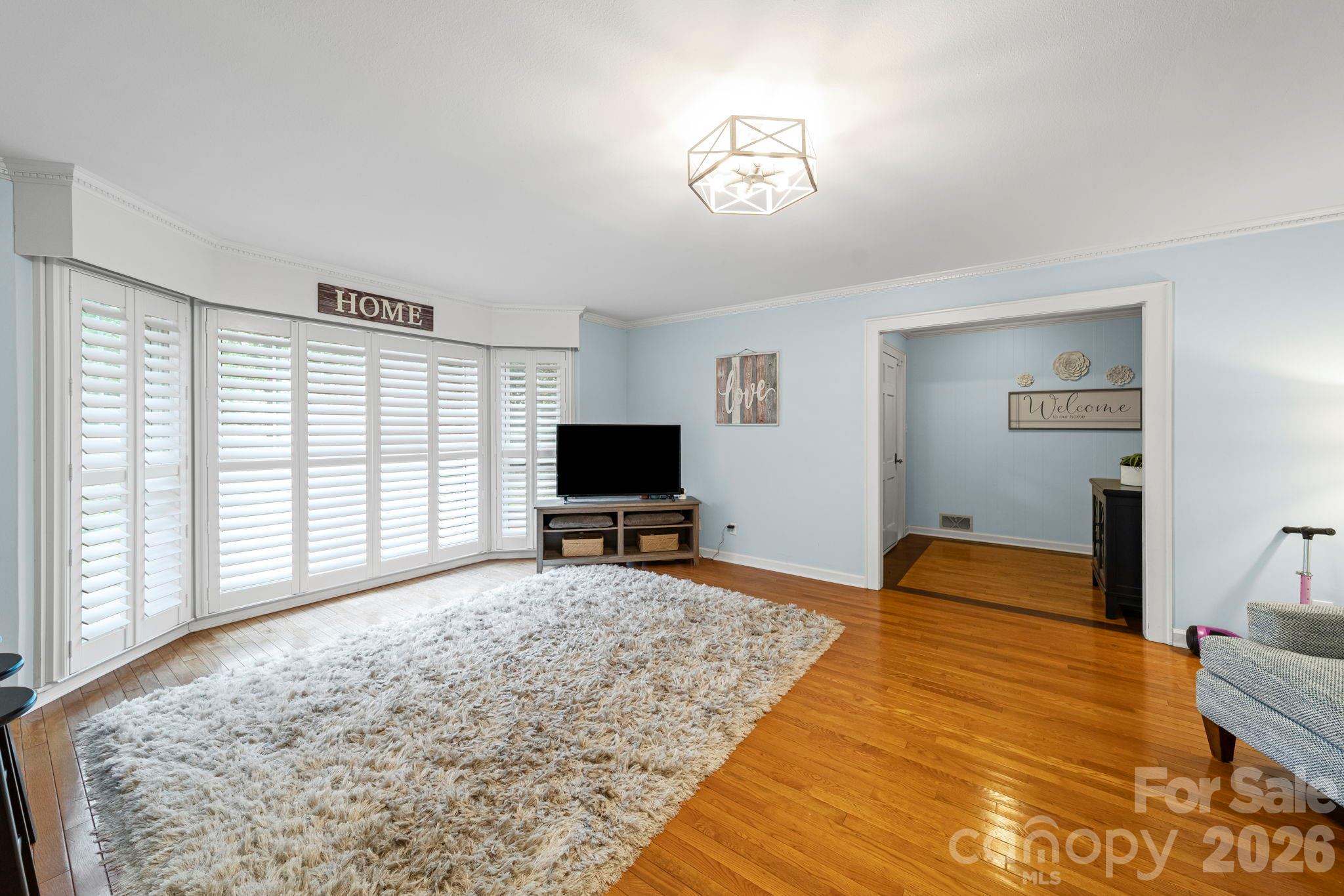 417 Park Ridge Road Albemarle, NC 28001 - Photo 7 of 47 a bedroom with a bed and a flat screen tv