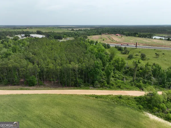a view of swimming pool with a back yard