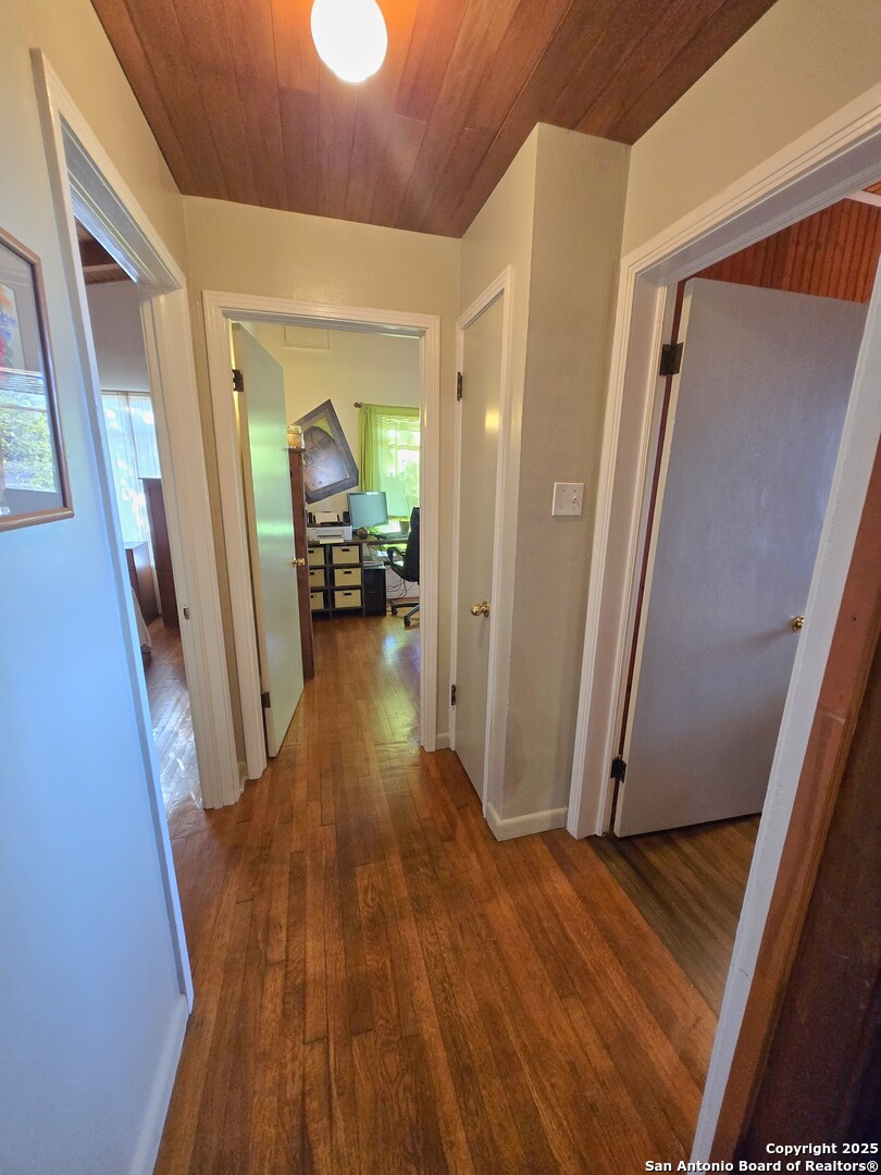 5564 Farm To Market Road 1103 Schertz, TX 78108 - Photo 13 of 35 a view of a hallway view with wooden floor and staircase