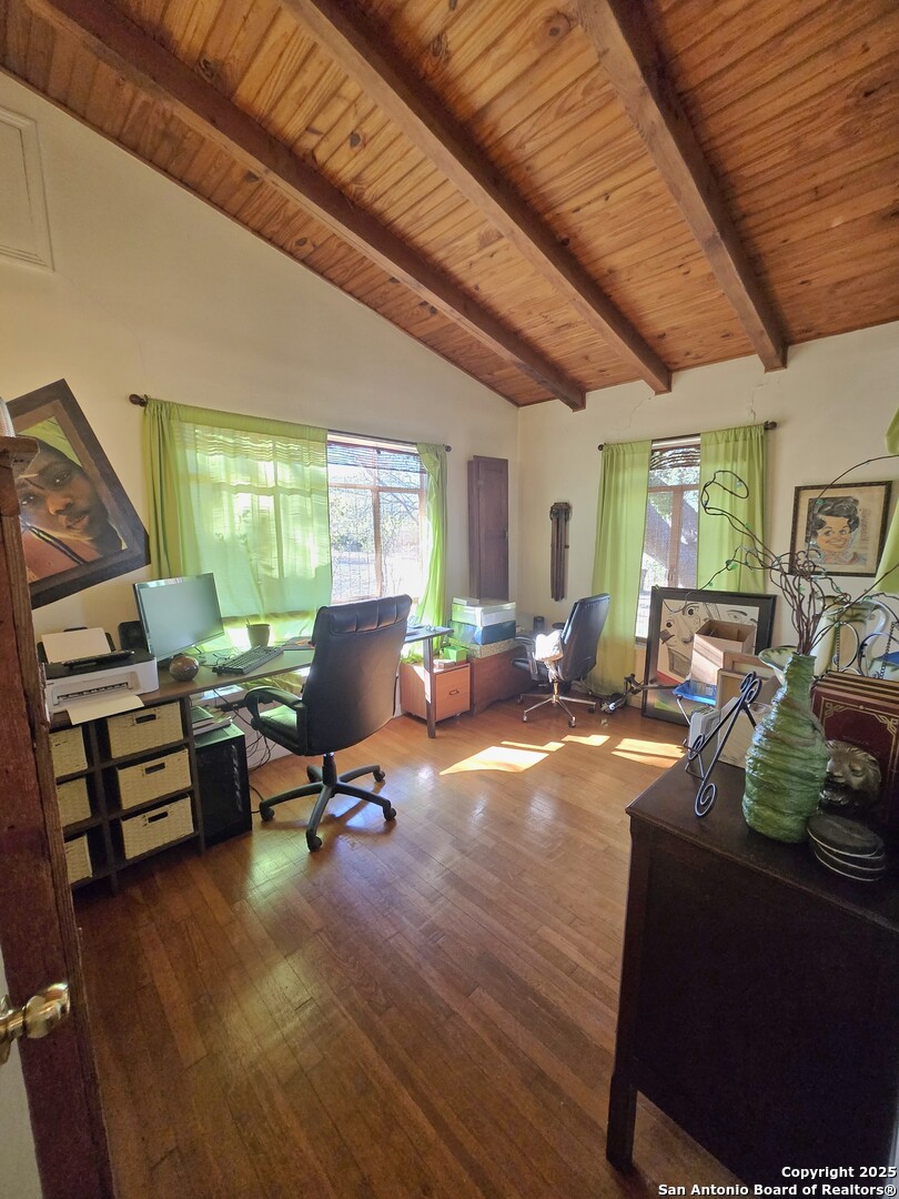 5564 Farm To Market Road 1103 Schertz, TX 78108 - Photo 17 of 35 a living room with furniture gym equipment and a large window