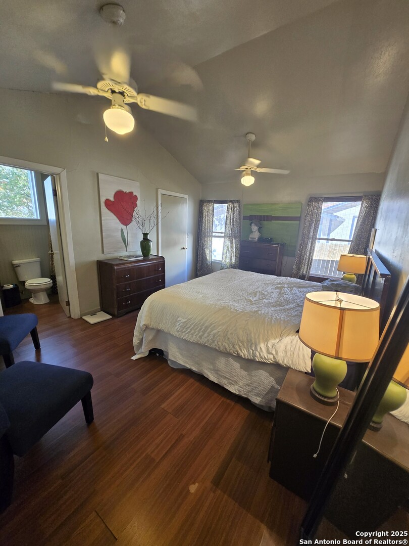 5564 Farm To Market Road 1103 Schertz, TX 78108 - Photo 21 of 35 a bedroom with a bed and wooden floor