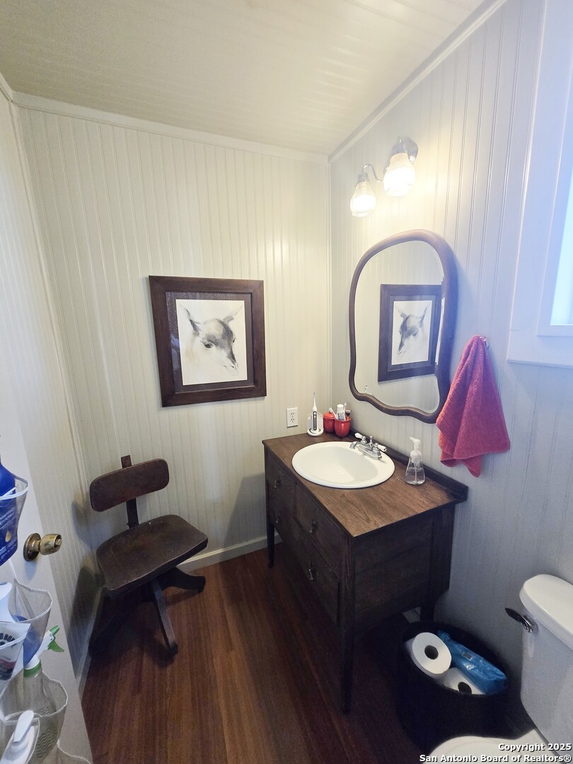 5564 Farm To Market Road 1103 Schertz, TX 78108 - Photo 25 of 35 a bathroom with a toilet a sink and mirror