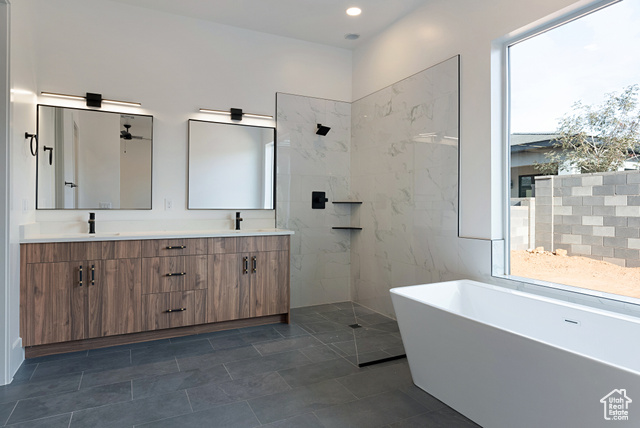 3145 Snow Cyn Road Hurricane, UT 84737 - Photo 14 of 38 Bathroom with double vanity, a freestanding bath, walk in shower, and recessed lighting