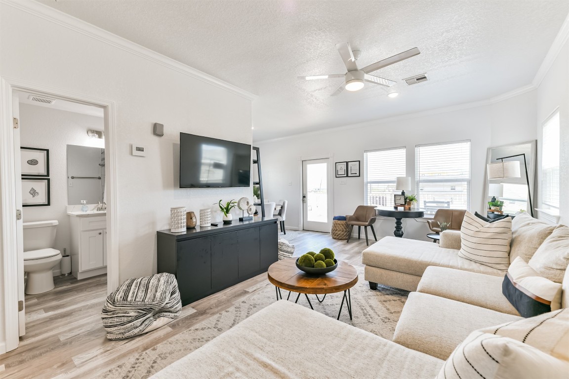 143 West Palm Surfside Beach, TX 77541 - Photo 12 of 38 a living room with furniture and a flat screen tv