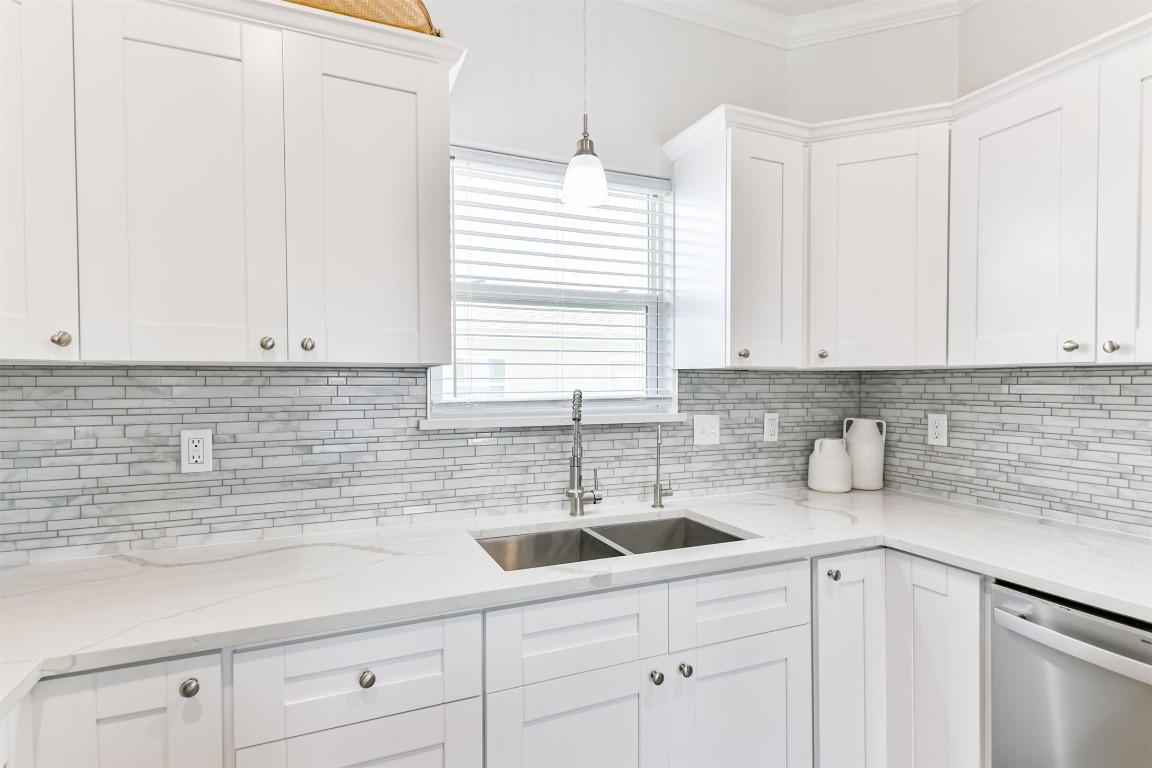143 West Palm Surfside Beach, TX 77541 - Photo 16 of 38 a kitchen with a sink cabinets and window
