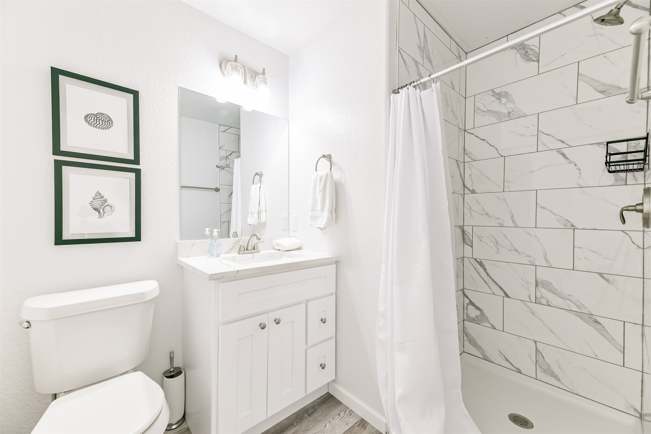 143 West Palm Surfside Beach, TX 77541 - Photo 18 of 38 a bathroom with a granite countertop sink toilet and shower