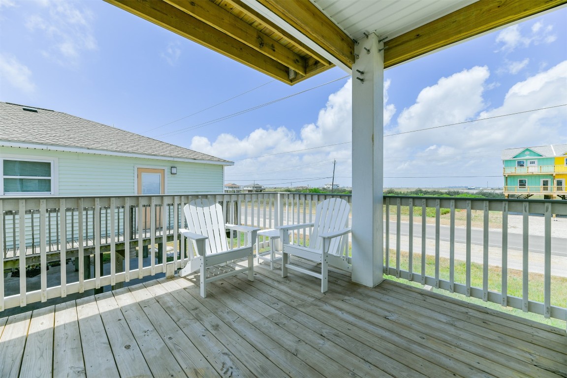 143 West Palm Surfside Beach, TX 77541 - Photo 19 of 38 a view of a balcony with wooden floor