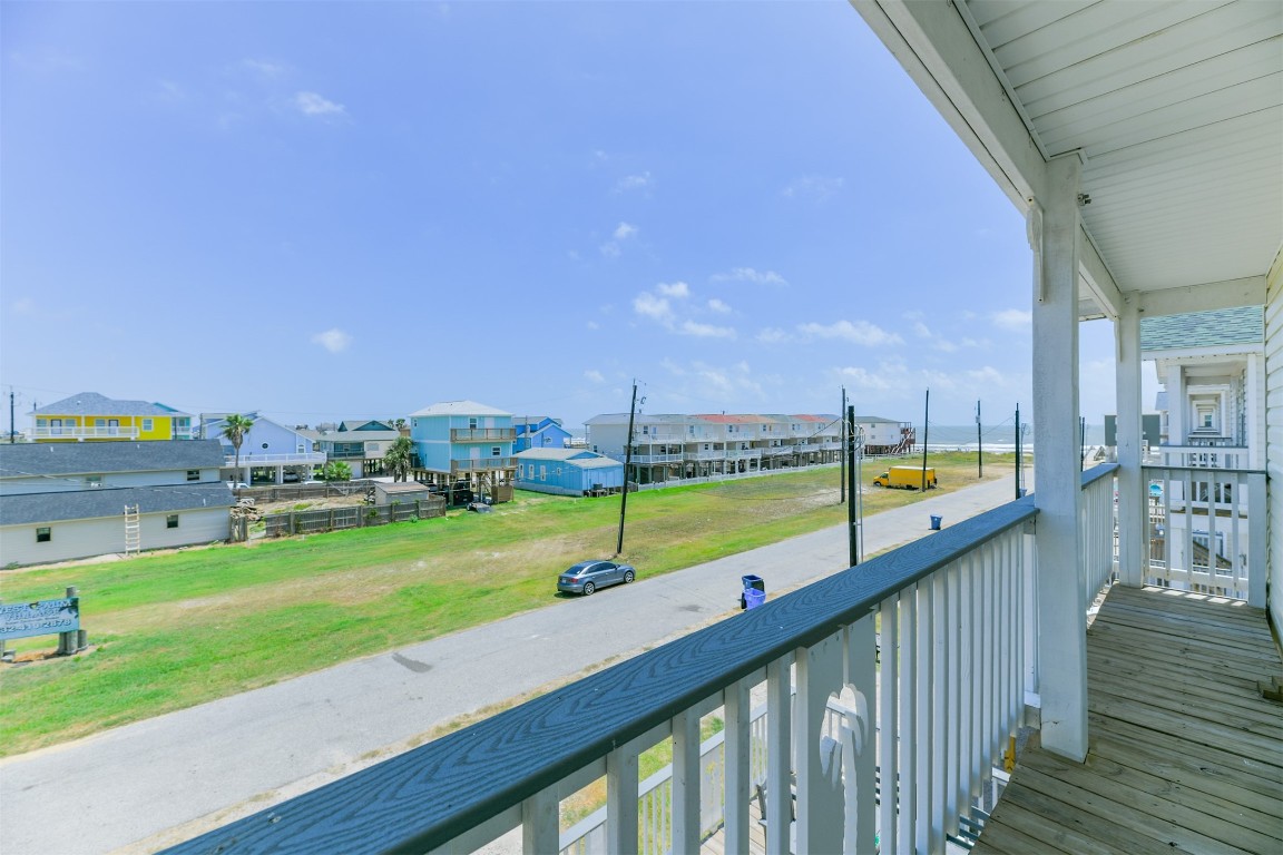 143 West Palm Surfside Beach, TX 77541 - Photo 22 of 38 a view of swimming pool from a balcony with lake view