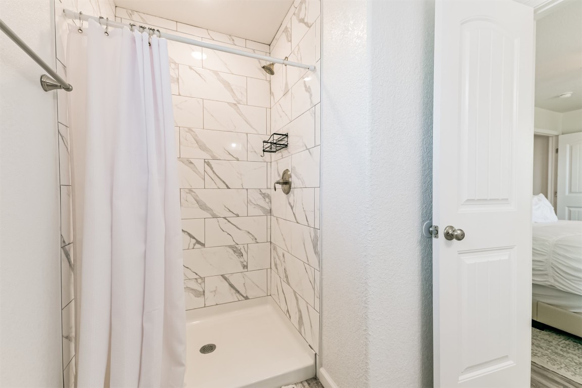 143 West Palm Surfside Beach, TX 77541 - Photo 25 of 38 a bathroom with a shower