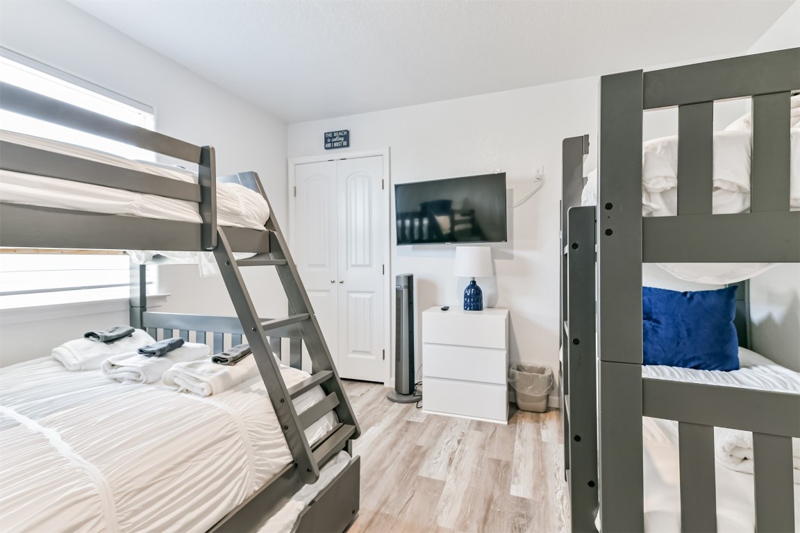 143 West Palm Surfside Beach, TX 77541 - Photo 26 of 38 a bed room with a bed a television and a window