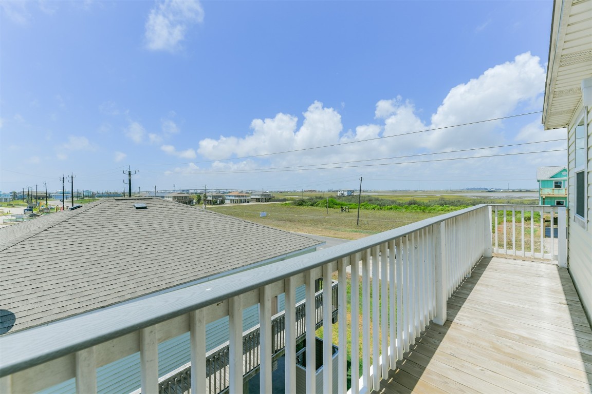 143 West Palm Surfside Beach, TX 77541 - Photo 31 of 38 This bedroom also has its own balcony!