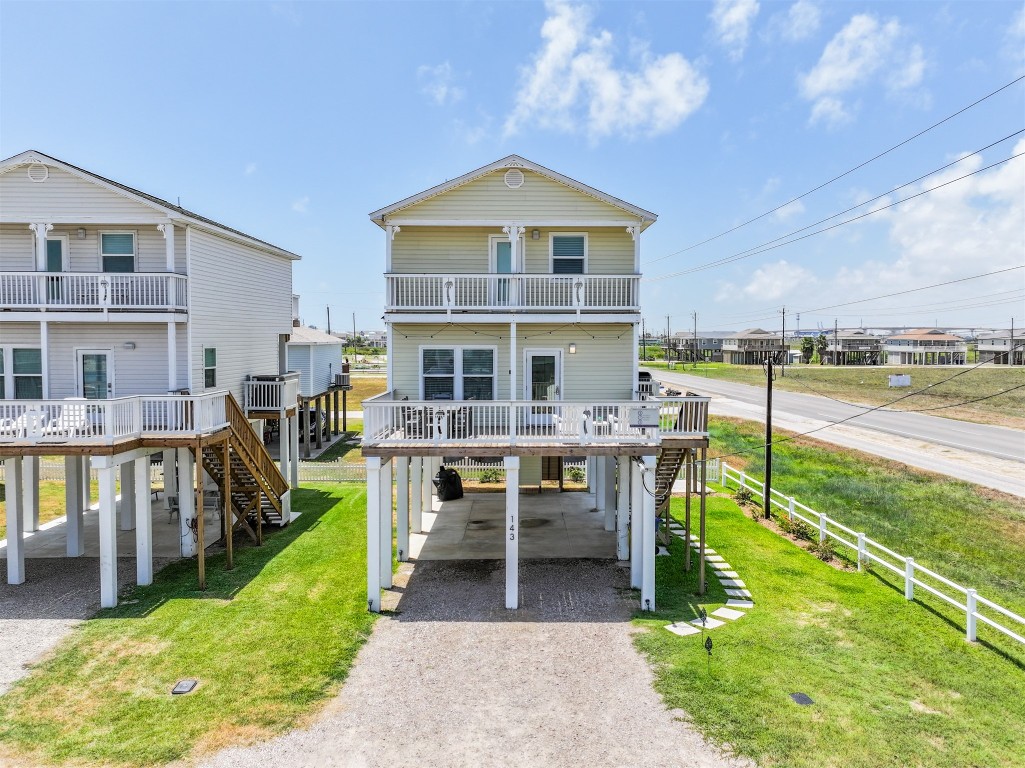 143 West Palm Surfside Beach, TX 77541 - Photo 34 of 38 a view of a house with backyard porch and sitting area
