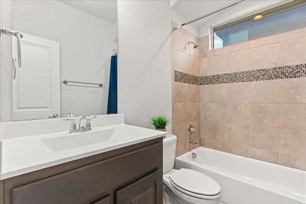 a bathroom with a sink a toilet and a bathtub