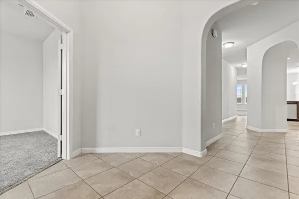 an empty room with mirror