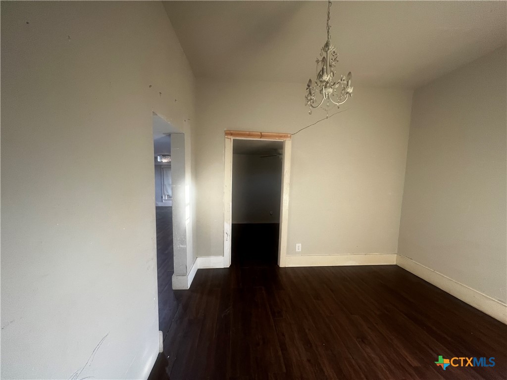 605 East Rogers Cemetery Road Rogers, TX 76569 - Photo 13 of 29 a view of a room with wooden floor and staircase