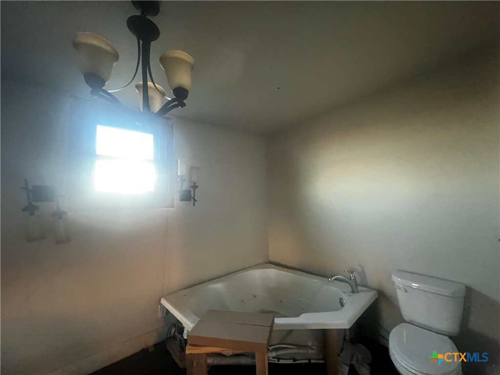 605 East Rogers Cemetery Road Rogers, TX 76569 - Photo 20 of 29 a bathroom with a toilet and a sink