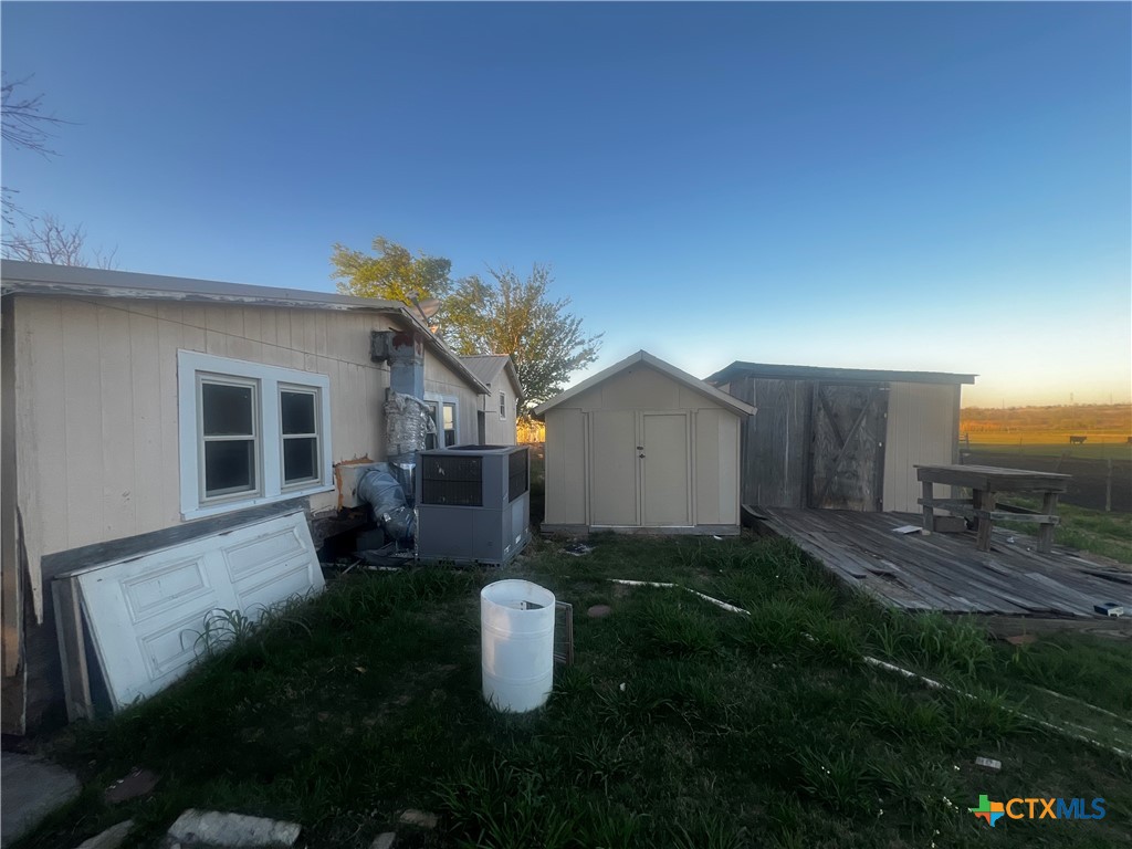 605 East Rogers Cemetery Road Rogers, TX 76569 - Photo 25 of 29 a view of a house with backyard and garden