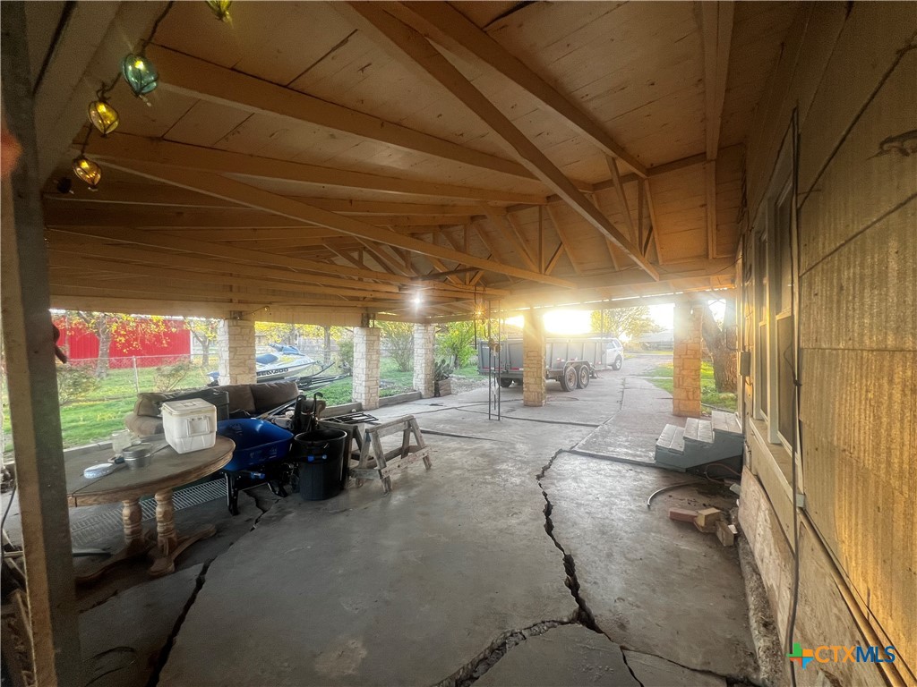 605 East Rogers Cemetery Road Rogers, TX 76569 - Photo 29 of 29 a living room with patio furniture and a potted plants