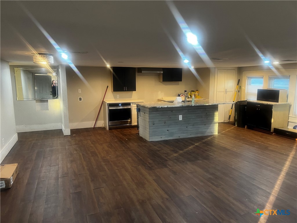 605 East Rogers Cemetery Road Rogers, TX 76569 - Photo 7 of 29 a view of kitchen with furniture and wooden floor