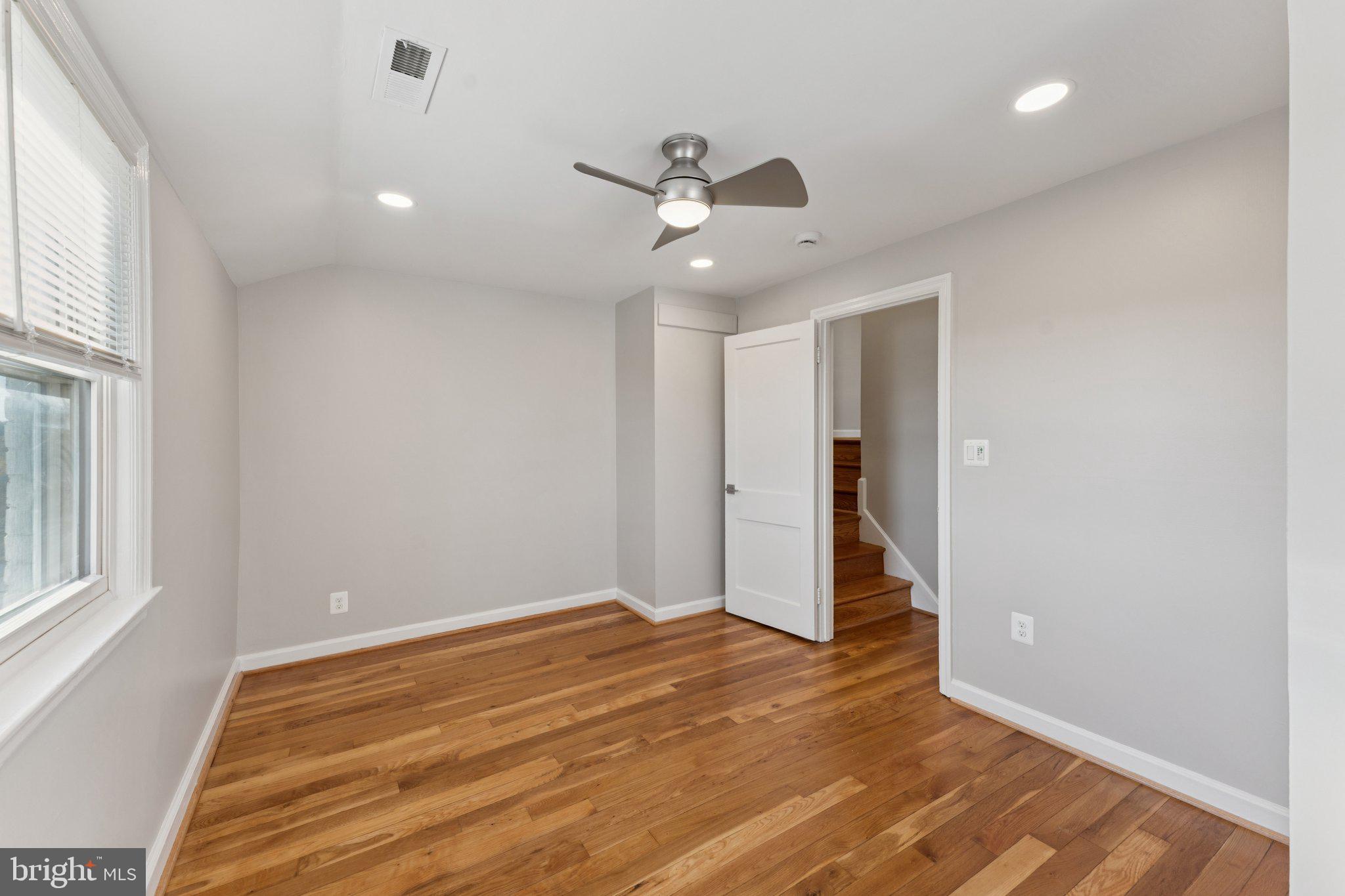 3621 South Kemper Road Arlington, VA 22206 - Photo 13 of 22 wooden floor in an empty room with a window