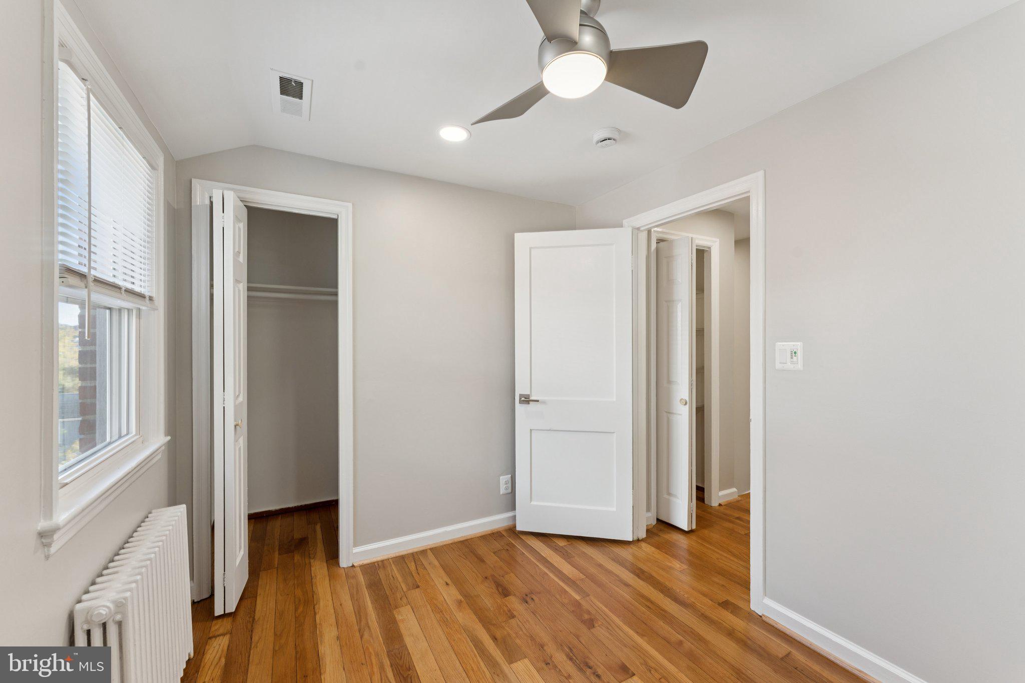 3621 South Kemper Road Arlington, VA 22206 - Photo 15 of 22 wooden floor in an empty room with a window