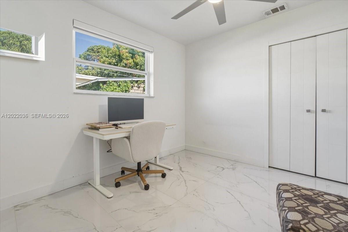 120 West 50th Street Hialeah, FL 33012 - Photo 14 of 22 a workspace with furniture and window