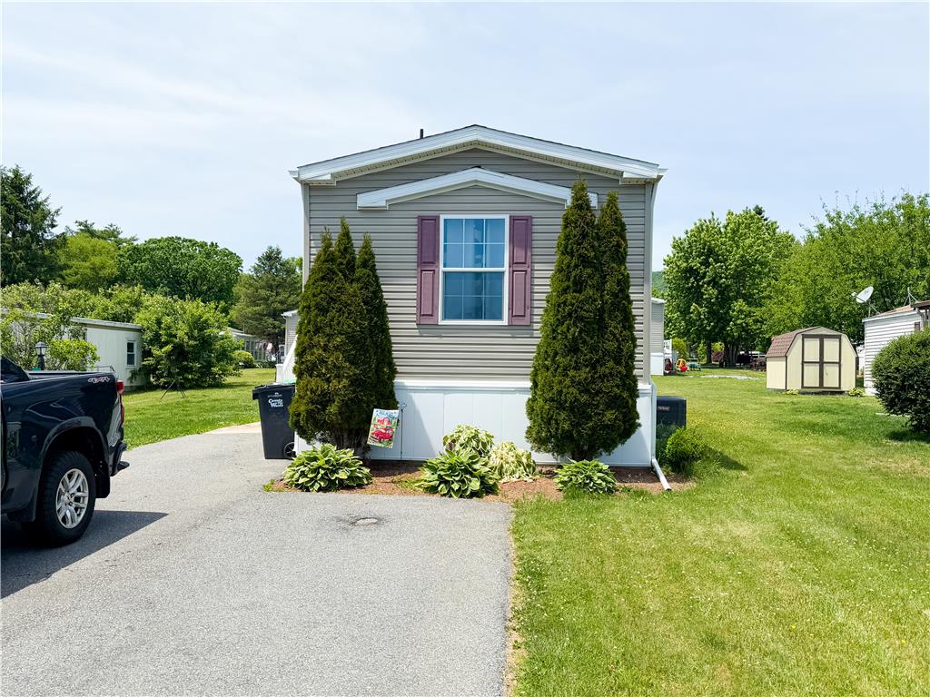 49 Ritz Craft Street Walnutport, PA 18088 - Photo 2 of 17 A neatly manicured lawn enhances the curb appeal of this charming, compact residence.