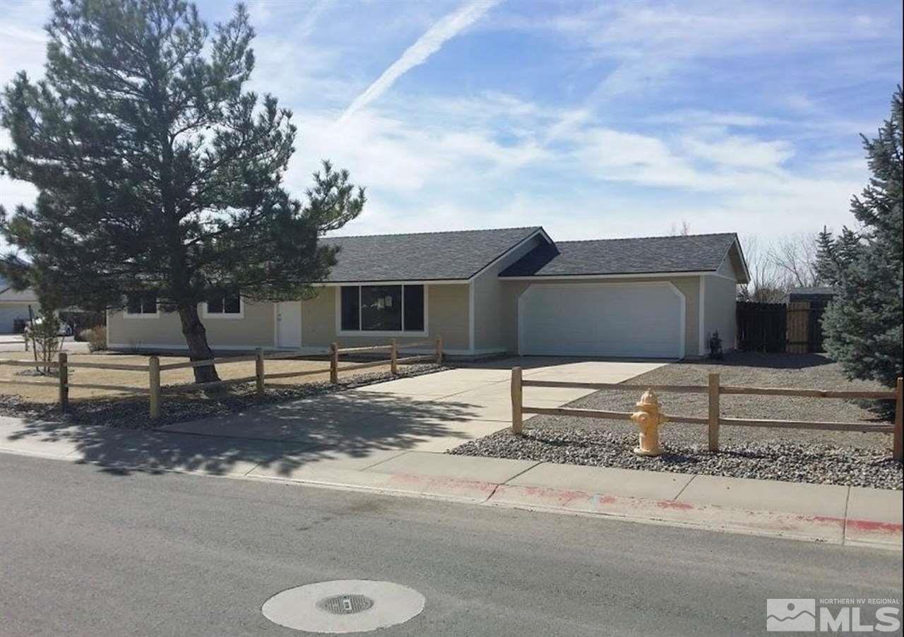 270 River Boat Road Dayton, NV 89403 - Photo 1 of 10 a front view of a house with a yard and garage