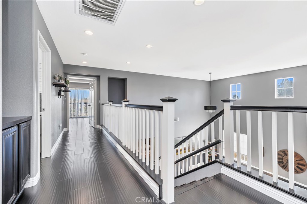 7029 Penny Court Rancho Cucamonga, CA 91739 - Photo 23 of 42 a view of a hallway with staircase