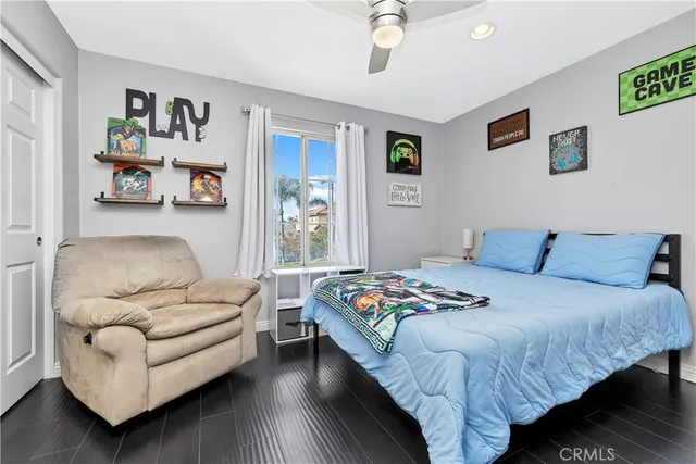 a bedroom with a bed and a couch