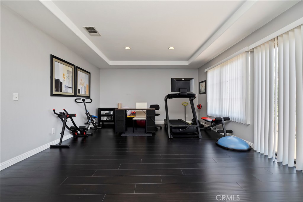 7029 Penny Court Rancho Cucamonga, CA 91739 - Photo 27 of 42 a living room with furniture and wooden floor