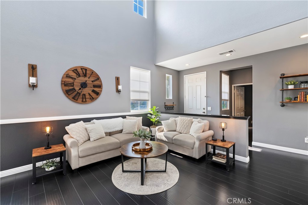 7029 Penny Court Rancho Cucamonga, CA 91739 - Photo 8 of 42 a living room with furniture and a wooden floor